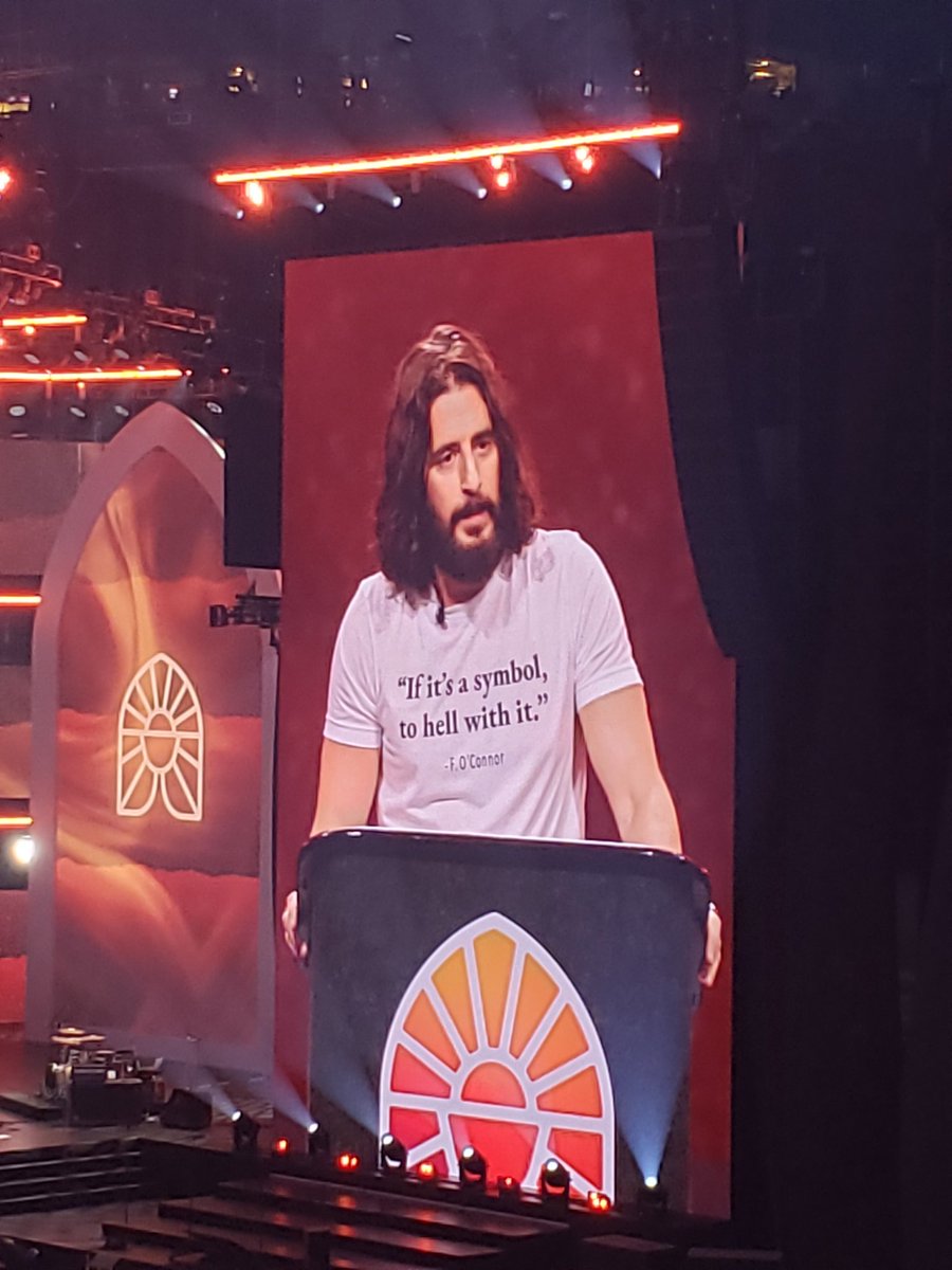 MegHunterKilmer's tweet photo. I am OBSESSED with @JonathanRoumie in this shirt. This is why we're here. Because the Eucharist is Jesus the Christ, the God of the universe made present for us. #EucharisticRevival https://t.co/pnq4voVOJy