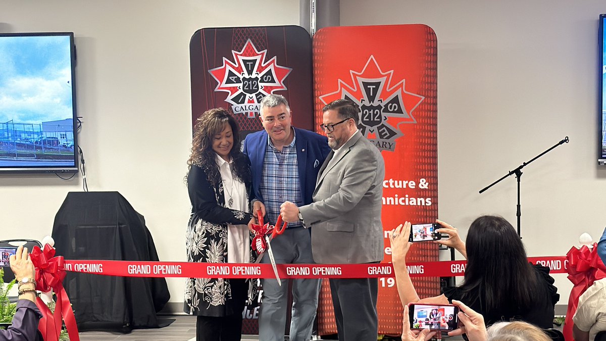 IATSE's tweet photo. U.S. and Canadian kin came together in Calgary, AB today for a proud moment of international solidarity as International President Matthew D. Loeb, Local 212 President Damian Petti, and Local 212 Operations Manager Dee Picciano cut the ribbon on the Local's new state-of-the-art training center!!