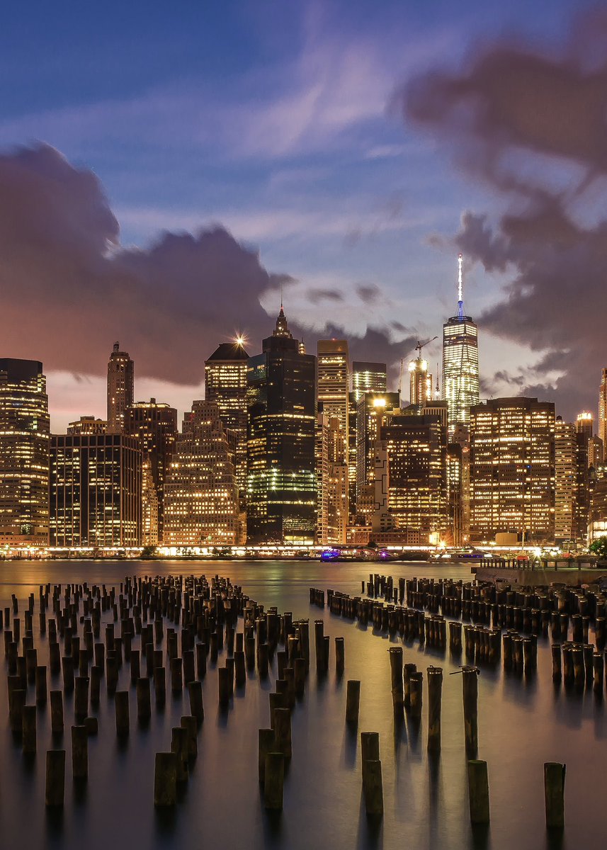 Lower Manhattan view from Old Pier 1, Brooklyn Bridge Park during blue hour.