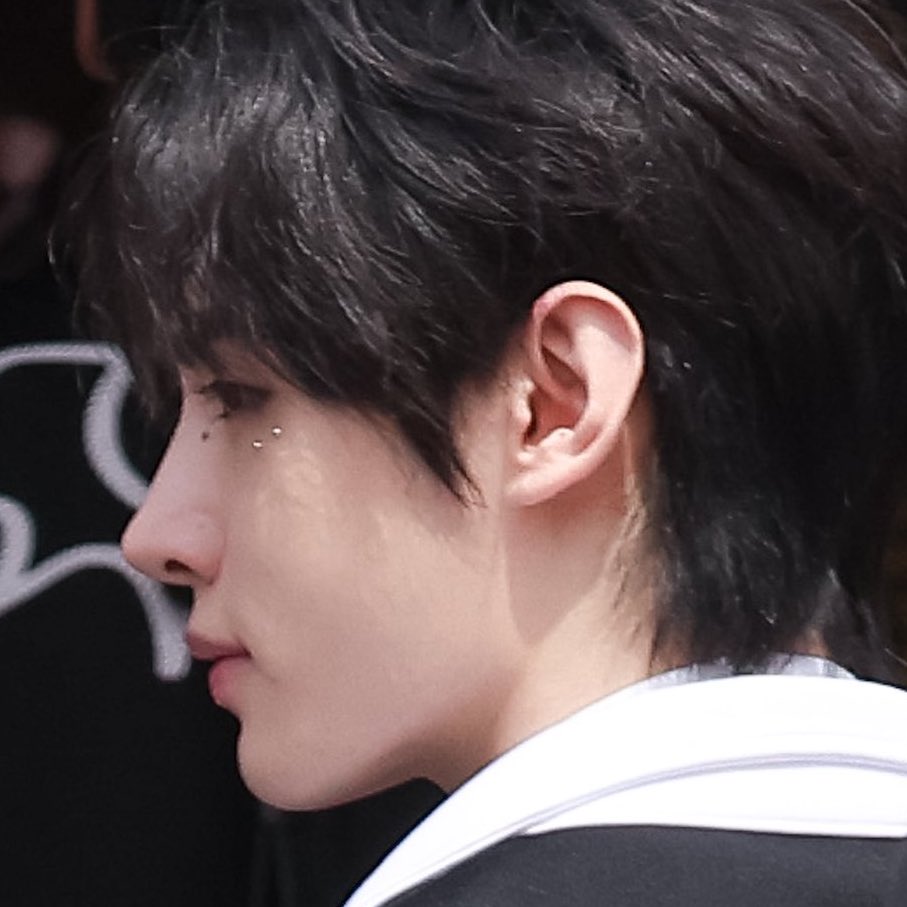 prodshn's tweet photo. sunghoon with wings and sticker beads under his eyes 🩶 https://t.co/tQo82u5rs5