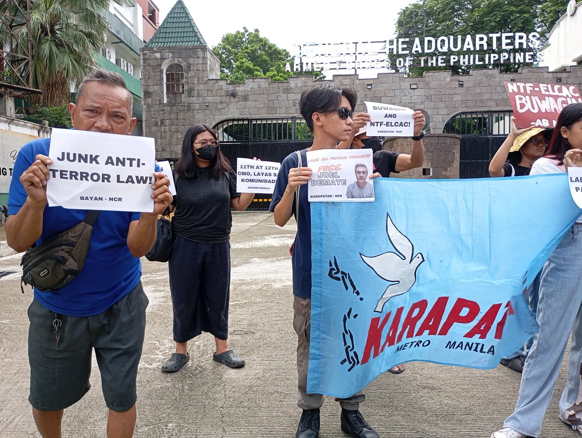 LOOK: Three days before Marcos Jr. SONA, human rights defenders and advocates troop to Camp Aguinaldo in Quezon City to condemn the militarization in Metro Manila, particularly the encampment of 11th and 12th Civil Military Operation in Tondo, Quezon City,