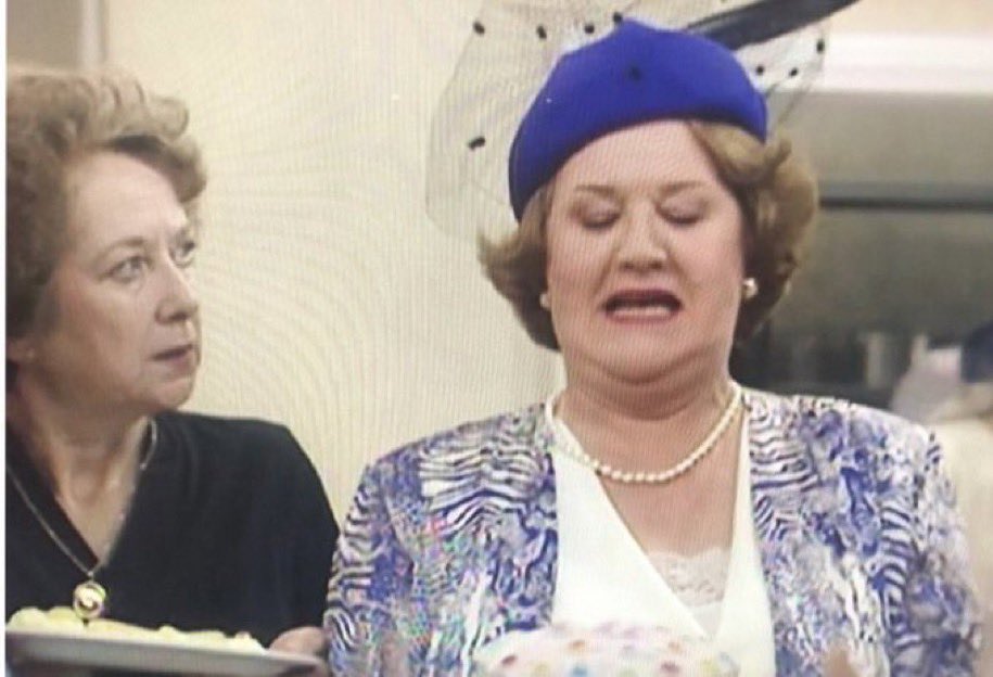 Hyacinth_Bot's tweet photo. Oh? Is that one of Mrs. Watson’s cakes? Oh yes, I can see it is now...She does try, Bless her..... https://t.co/t3f4qQCHwW