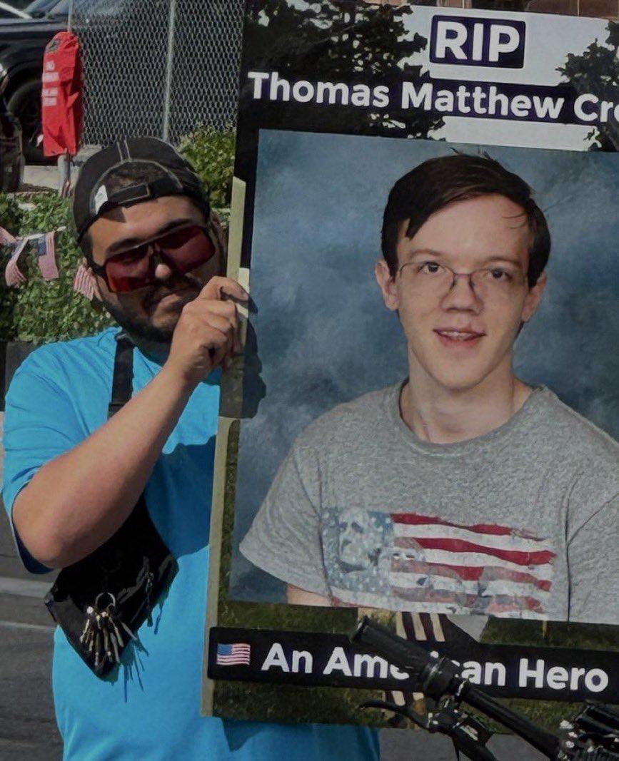 Man holds up sign outside of RNC. #TrumpShot  #ThomasMatthewCrooks