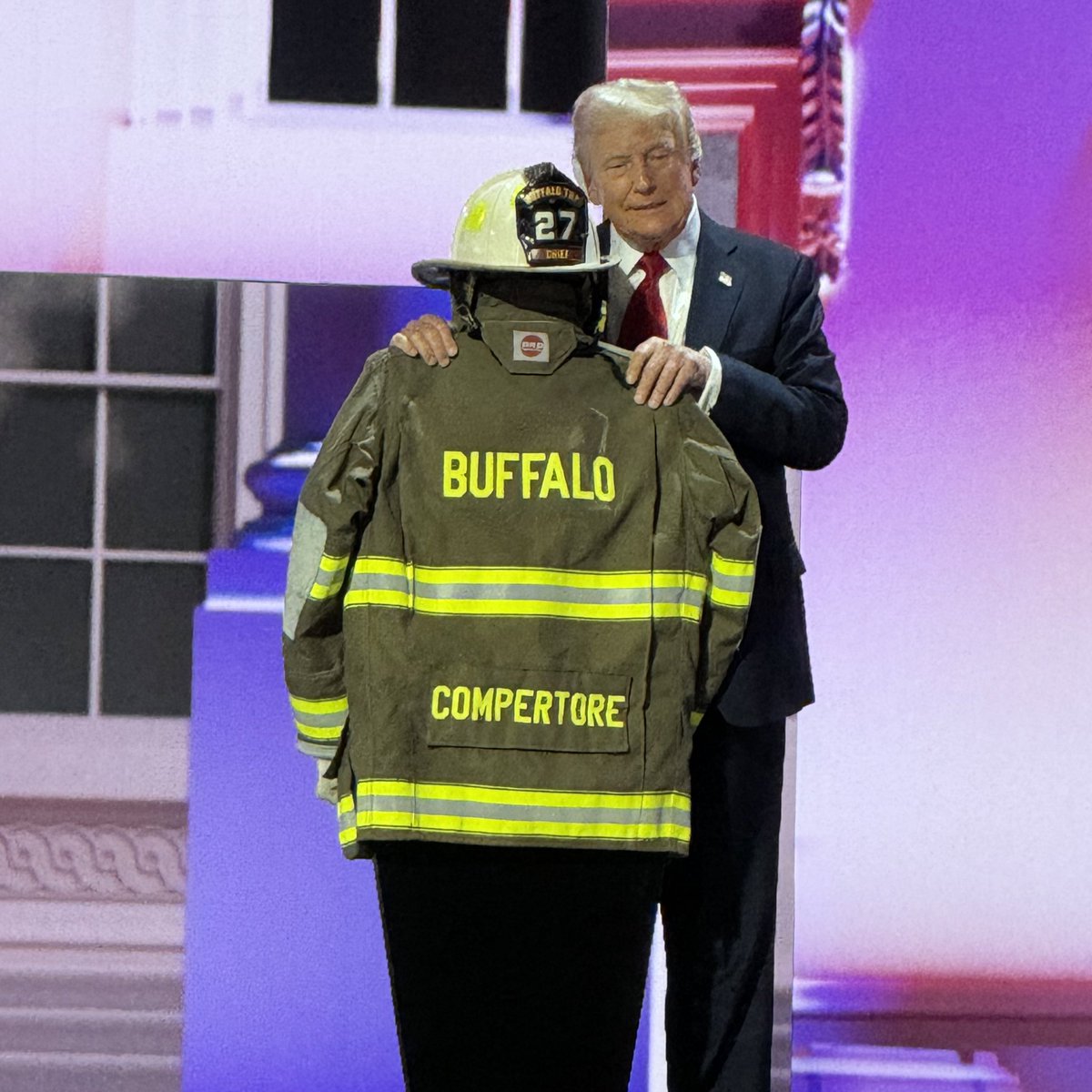 jhf_julia's tweet photo. RT @markkayeshow: Trump embraces Corey Competore’s fire gear. OMG. Chills. https://t.co/X09lynwKZF