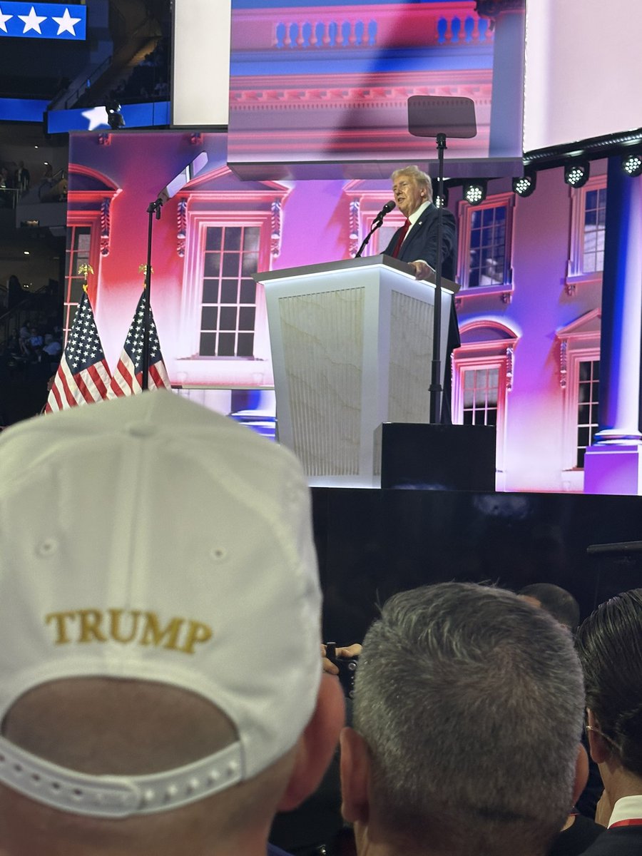 I’m standing 10 feet from the stage, in a sea of diehards, and some are getting restless. Checking phones, stealing glances at the teleprompter, whispering about when it will be over.