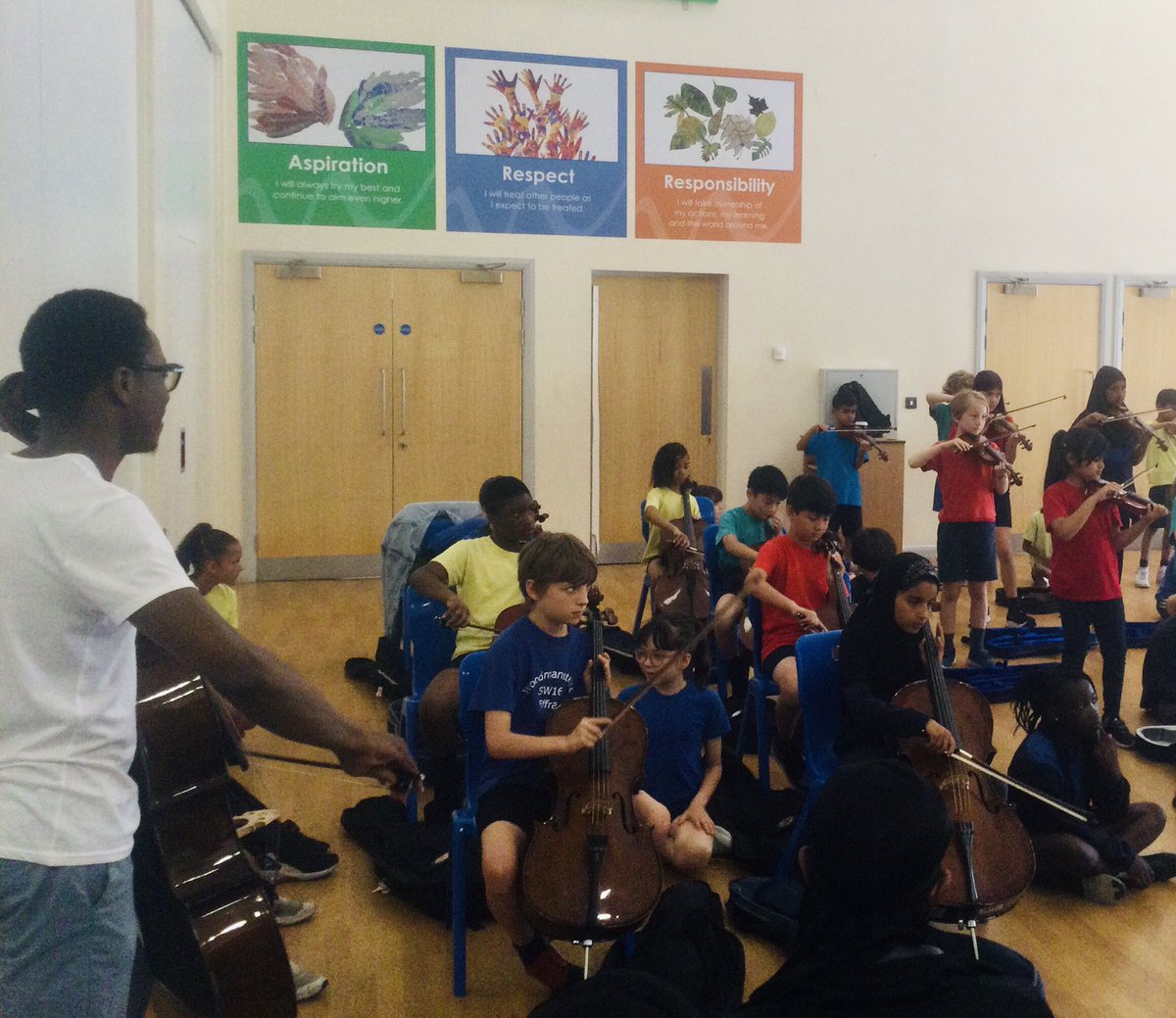 PrimaryWoody's tweet photo. We had a fun filled concert from 4B and 4OM on their violins and cellos this morning! We especially enjoyed the visit to space! Thanks @LambethMusic https://t.co/atwoqgE6EX