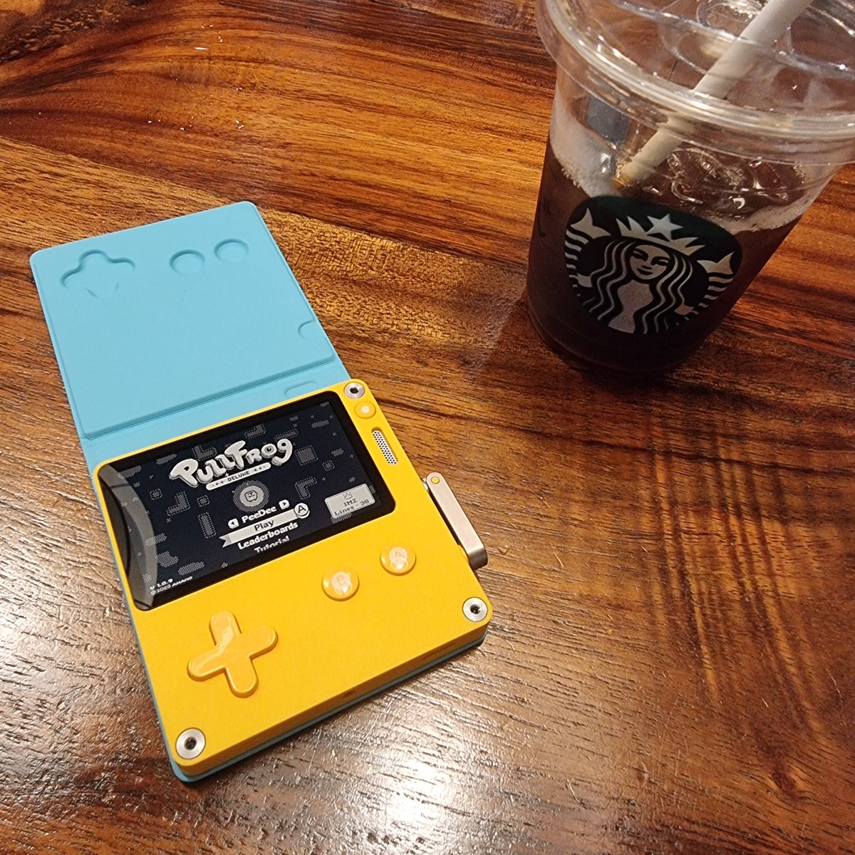 Ishmokin's tweet photo. Playdate with me everywhere I go. Did some pullfrog runs at the barbershop and at the coffeeshop. Portable gaming back fitting in the pocket. Which the Switch cant do. Even smaller than my phone 😊. #Playdate #Pullfrog https://t.co/Q7kFxwx10G