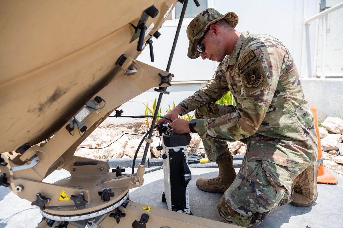 A technician assigned to the 379th Expeditionary Communications ...