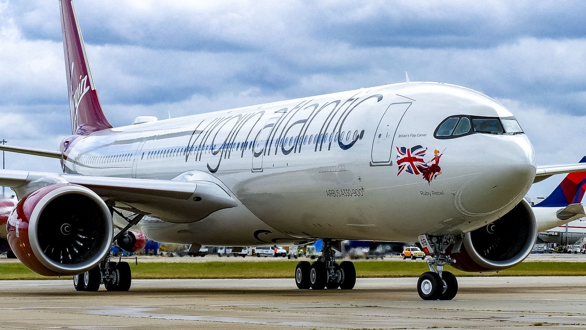 FIAFarnborough's tweet photo. @VirginAtlantic's newest A330-900neo, G-VSRB "Ruby Rebel," will be on display at #FIA2024 until Thursday 25 July, featuring a special 40th birthday decal. Named in honor of Sir Richard Branson, Ruby Rebel celebrates 40 years of Virgin Atlantic revolutionizing the travel industry. https://t.co/AEJ9BruyyD