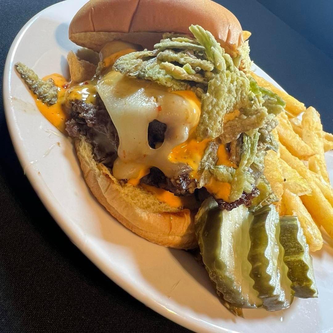 TaphouseEdge's tweet photo. Have you tried our Bite Your Face Smash Burger? This smash burger is topped with pepper bacon, ghost pepper cheese, sweet pepper relish, frizzled jalapeños, and our signature boom sauce. This burger brings some heat! https://t.co/kcUccGigPi