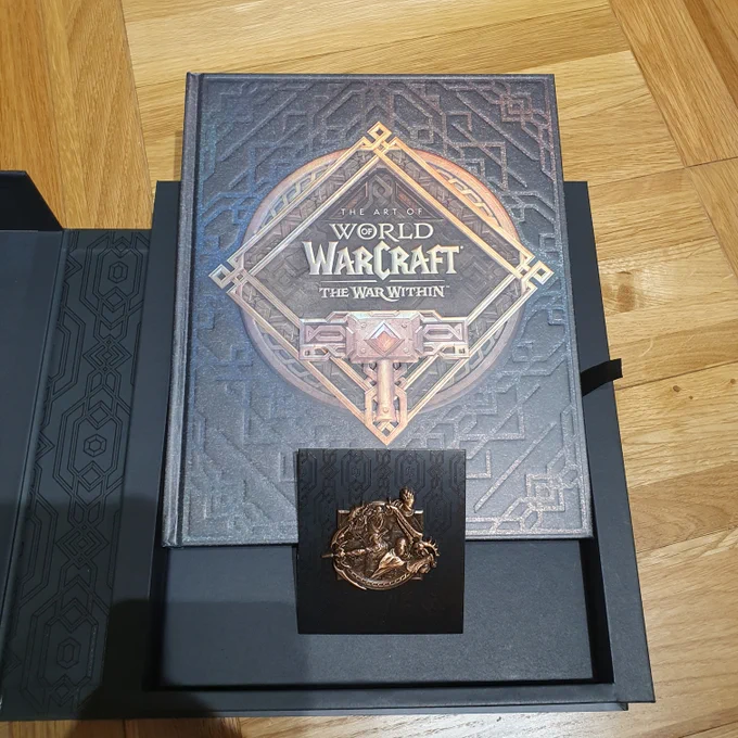 World of Warcraft 20th Anniversary Edition art book and pin