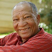 jfjoubert's tweet image. Don Materra's poem, "For a cent" followed by an Afrikaans translation. 

Apartheid's harm will stay with us for generations.

For a cent

Each morning
corner of Pritchard and Joubert
leaning on a dusty crutch
near a pavement dust-bin
an old man begs not expecting much.
His…