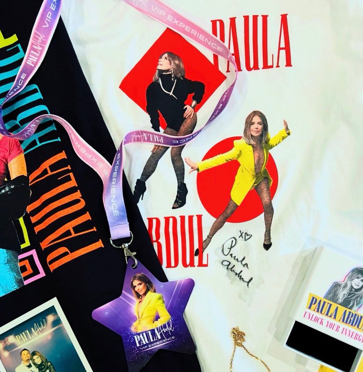 PaulaAbdul's tweet image. I can’t believe we’re already halfway through the #MagicSummerTour! Who’s been out to a show so far? If you haven’t yet, here’s a peek at my new merch tees and the goodies you get with my VIP package 🤭✨ For more details and to secure your VIP package, visit…