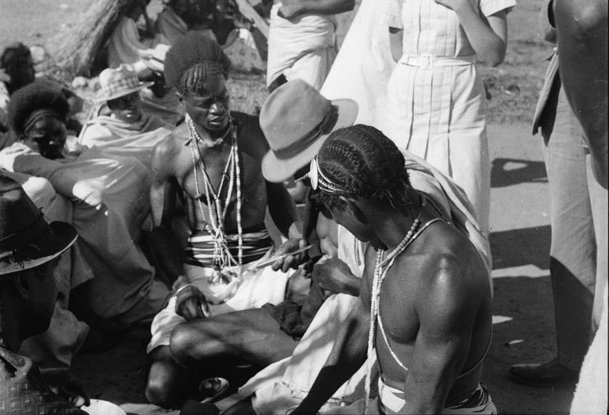 c.1940-1941 - Diverse hairdressing amongst men from Madagascar.