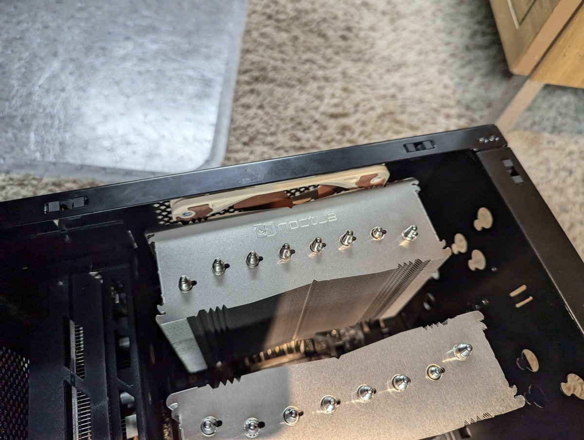 TheProfosist's tweet photo. Seems like I'll just be able to sneak in a slim #NFA12x25 behind the #NHD15G2 in #ChibiPC

I don't know how much it'll help but hey I had it already might as well give it a shot.
#CustomPCBuild #PCrepair #BuildLog https://t.co/dLq3NQ9N4A