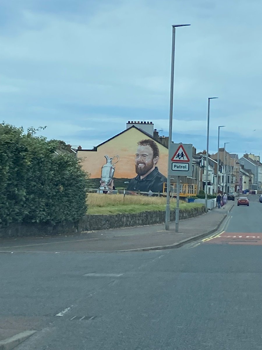 gvgreene's tweet photo. @ShaneLowryGolf Excellent mural.  Portrush is either preparing for 2025 or are predicting a big day on Sunday. Good luck. https://t.co/iVgJsZhWuv