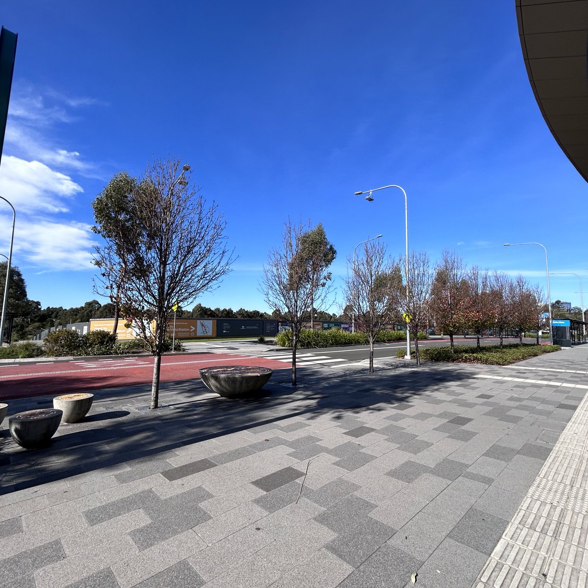 hamhammer27's tweet photo. The odd part about some of these stations is the land around them.

Despite the line being 5 years old, it’s surreal to exit these stations to just vast empty land like here at Bella Vista and Kellyville.

The NSW TOD program aims to fix this though: https://t.co/UnUaNBgvBE https://t.co/ZazFWILLgb