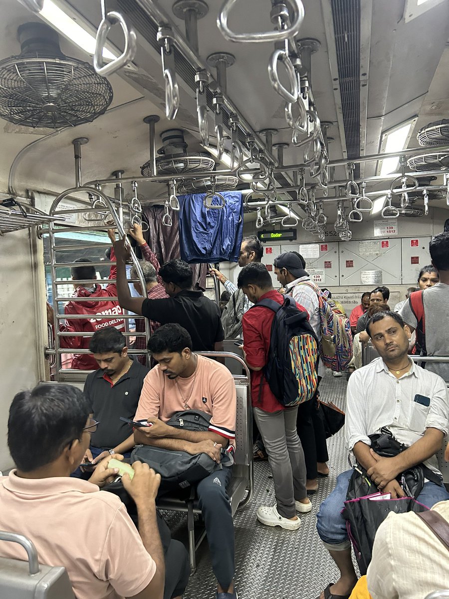 drharsh89's tweet photo. Local trains doubling up as clotheslines during the monsoon season 🚂☔️ #multitasking @IndiaWeatherMan @mumbaimatterz @mumbailocaltrain https://t.co/5ytJrhzBhp