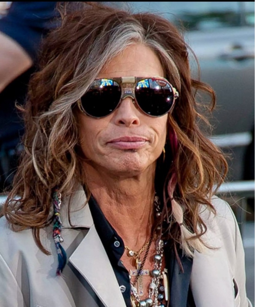 Sarah Palin looking particularly radiant. Wonder who does her hair?