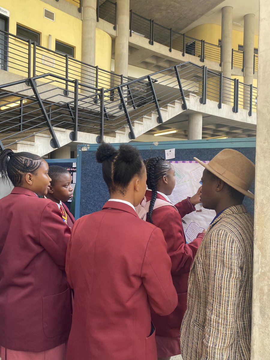 These bright students are presenting their spontaneous posters to the judges