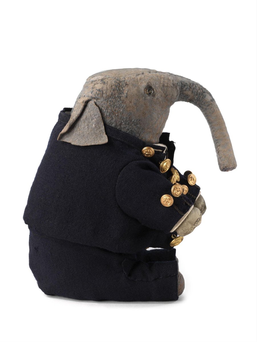 wikivictorian's tweet photo. 'Pumpie' elephant soft toy made of grey felt, dressed as a sailor in a smart, dark blue, woollen jacket and matching trousers, England, 1900. Victoria &amp; Albert Museum. https://t.co/Gr8PtyTk8b