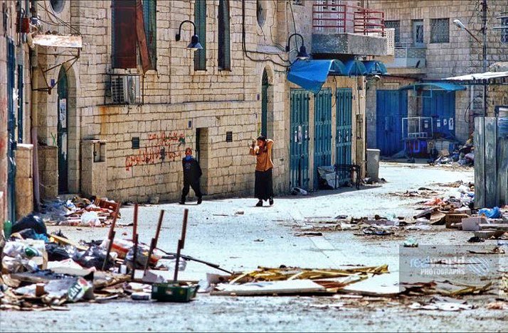 RealWorldImage's tweet photo. Two kids venture out during curfew during tensions in Beit Jala, West Bank, Palestine in 2002. Gary Moore photo. Real World Photographs. #war #conflict #Nikon #realworldphotographs #garymoorephotography #Palestine #conflict #BeitJala #photography #photojournalism https://t.co/917nIf54Xl
