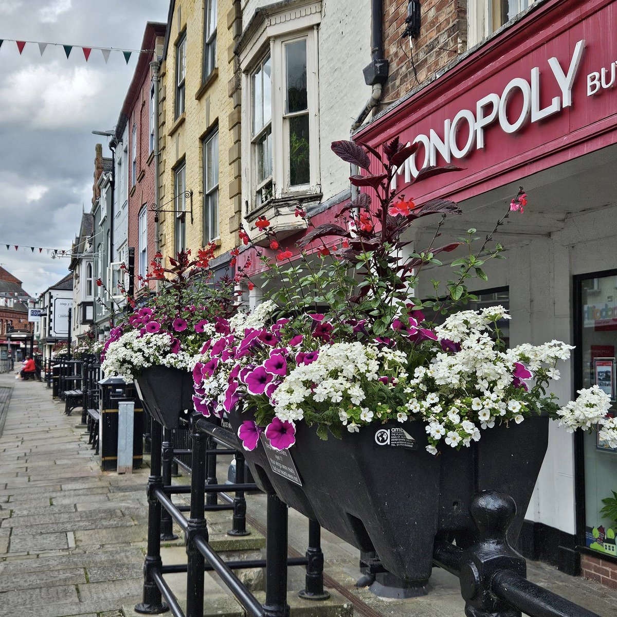 Our railing baskets are really starting to fill out along the High Street <a href="/amberolUK/">Amberol UK</a>