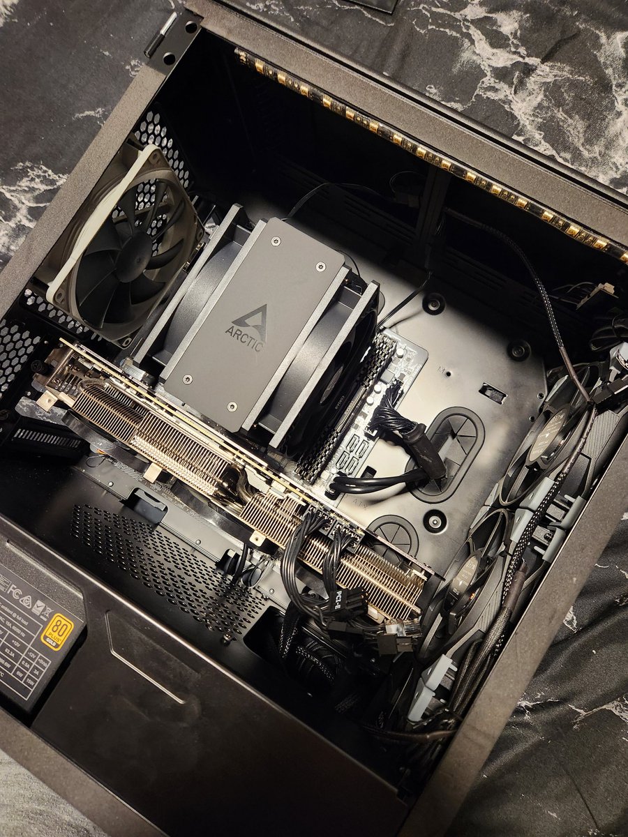Huggliest's tweet photo. @hellostal One of the systems in my 2in1 PC died last night and I had to pull it apart and rebuild it in a different case and had to run and grab a new CPU cooler cause the liquid radiator was a half inch too big to fit the video card. Took me 8 hours in the heat. :( https://t.co/uT5viMl6x7