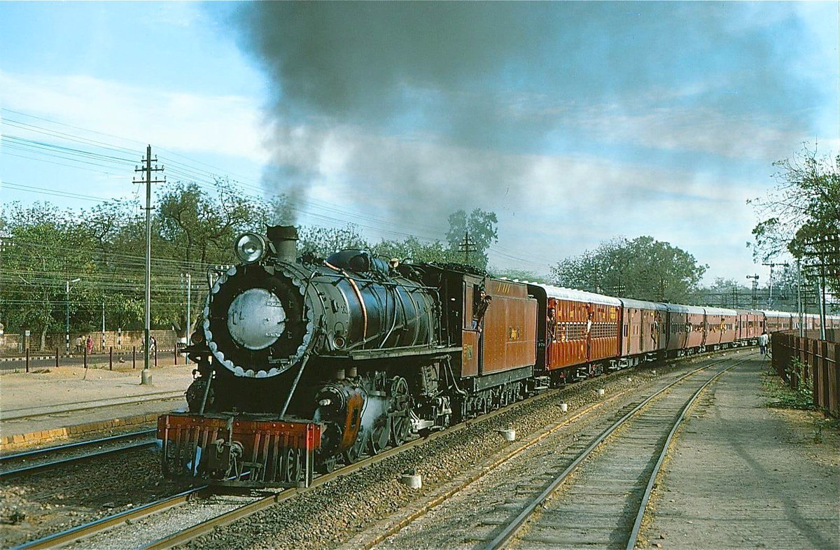 A beautiful photo of an HP meter gauge locomotive hauling the Jodhpur Barmer passenger, captured at Jodhpur in March 1978 by George Woods. The HP class locomotives, built by Baldwin in 1925, were the largest and heaviest MG locos to be used in India. <a href="/SachinKalbag/">Sachin Kalbag</a> <a href="/somnath1978/">Somnath Mukherjee</a>