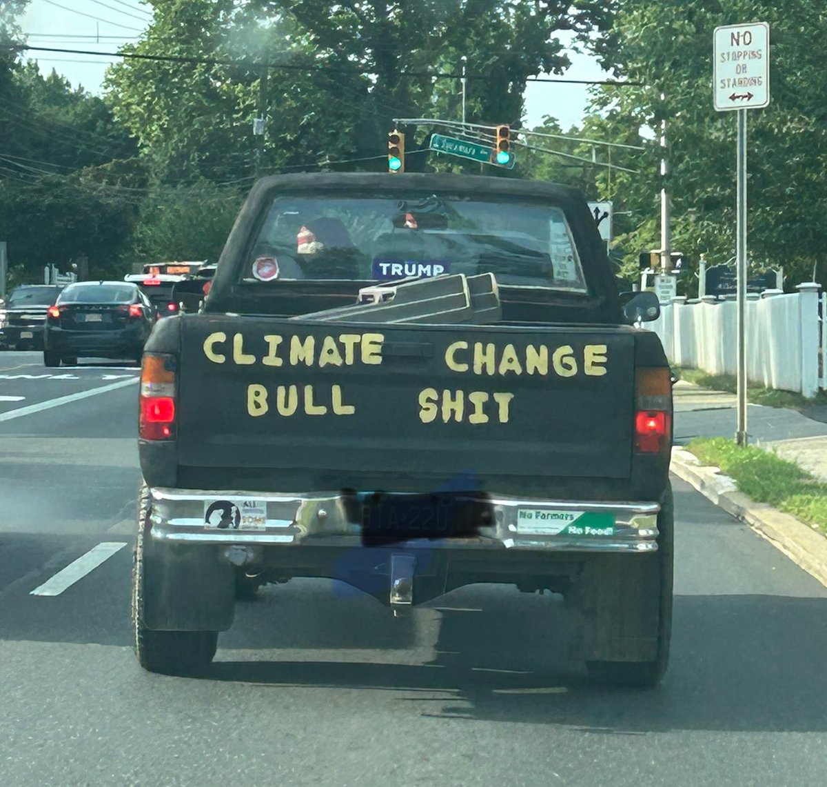 ItSaysLibby's tweet photo. The juxtaposition of this #Climate #ClimateChange denial statement with a #NoFarmersNoFood bumper sticker is baffling. https://t.co/axgmYTNxoy