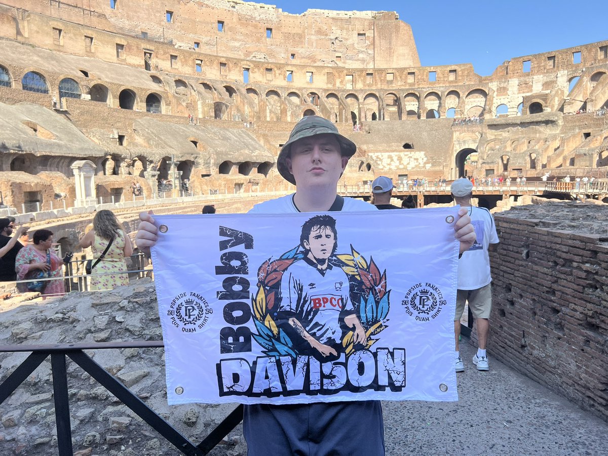 TheNickAllgood's tweet photo. .@PopsideFanatics my lad flying the flag in Rome. Photobombed by my other half.
#ramsontour #derbycounty https://t.co/Rca5pM5vky