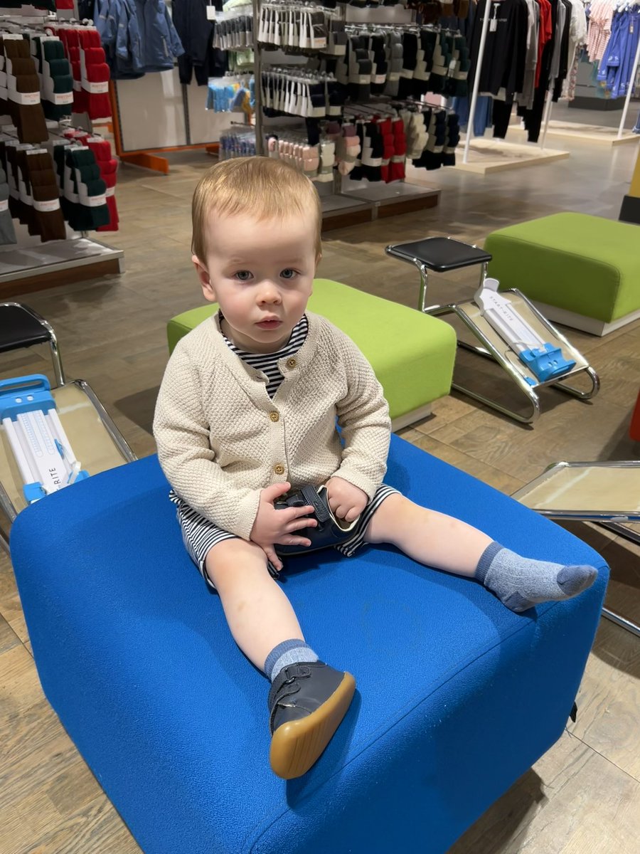 SamBlacow's tweet photo. Baby Thomas patiently waiting @JohnLewisRetail for his turn in the line to have his feet remeasured 🦶🏼📏💙 for @clarksshoes 
He was living his best life surrounded by shoes - his favourite thing in the world 👟 https://t.co/TWev0IbU5C