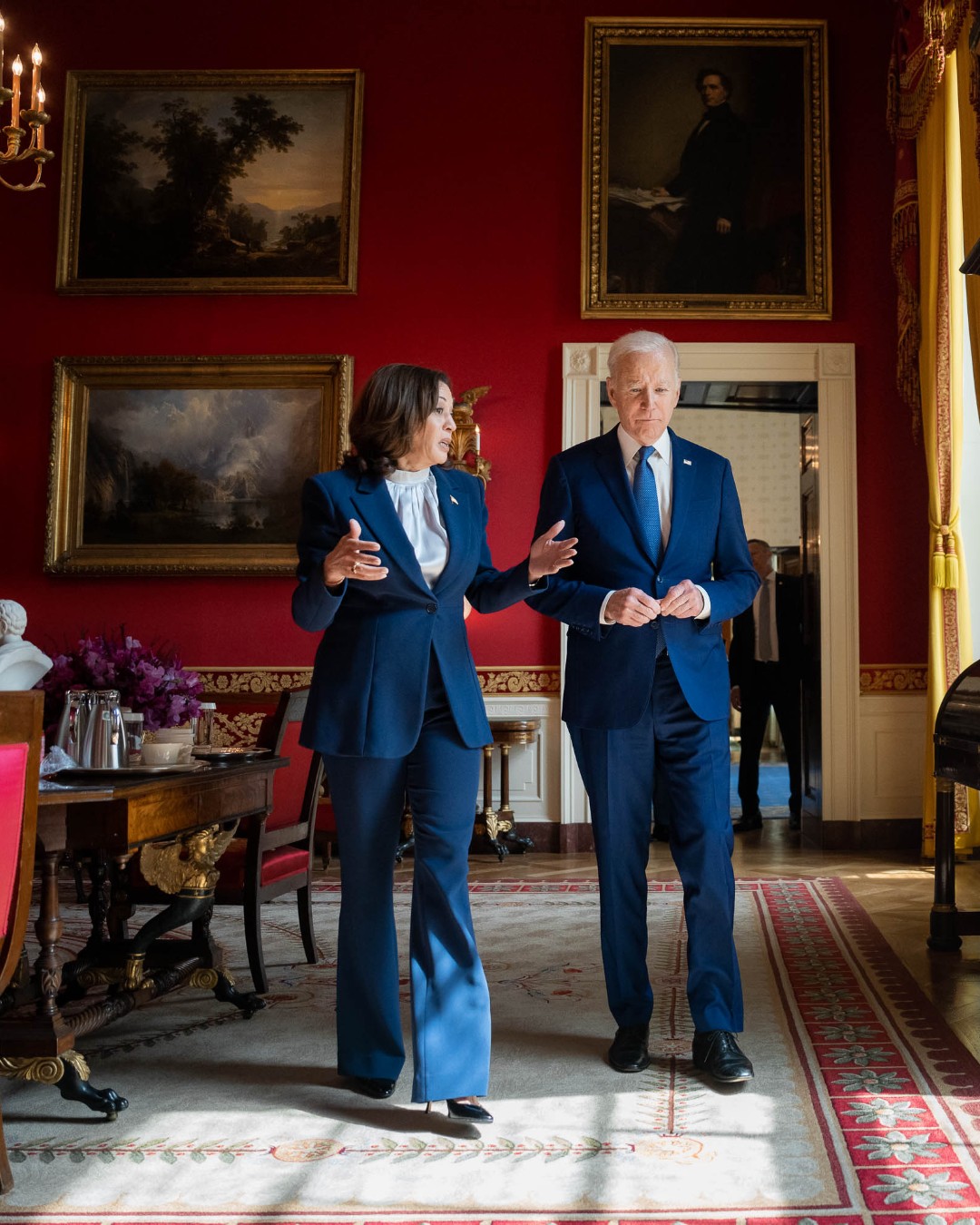 President Joe Biden talks with Vice President Kamala Harris in the Red Room of the White House, after an event celebrating the 13th Anniversary of the Affordable Care Act.