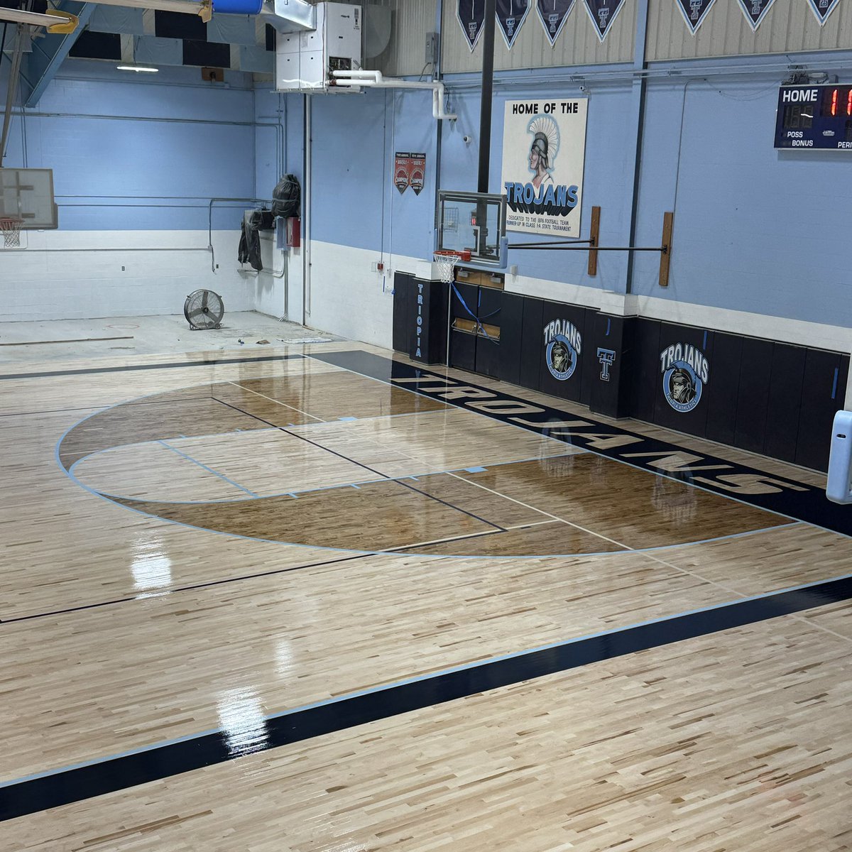 TriopiaCUSD27's tweet photo. Please see the attached photos of the painted gym floor. The last seal coat will be applied on Monday. After that, we are ready for the poured floor where the stage used to sit and then the new bleachers will be installed by mid-August. #triopia @OmniEP1 @MissouriFloor https://t.co/pCxDTg8D79