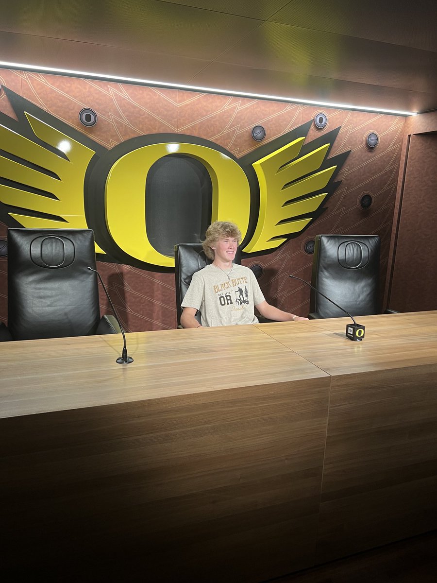 Brooks sitting in the post game interview room.