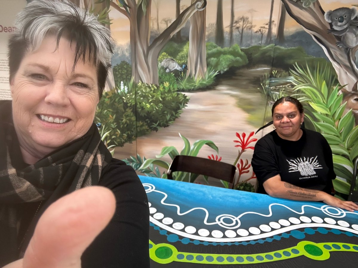 CentacareCCSA's tweet photo. 🎨🌟 Thumbs Up to Jaylene Ware! 🌟🎨
Proud of @Centacare_CSA staff member Jaylene, commissioned by @AdelaideAirport's RAP Committee to create a stunning piece of art during this NAIDOC Week. 
📸 Dr Jen Cleary with Jayla &amp; her artwork.
#CCCSA #NAIDOCWeek #Reconciliation https://t.co/FXQLycn7RB