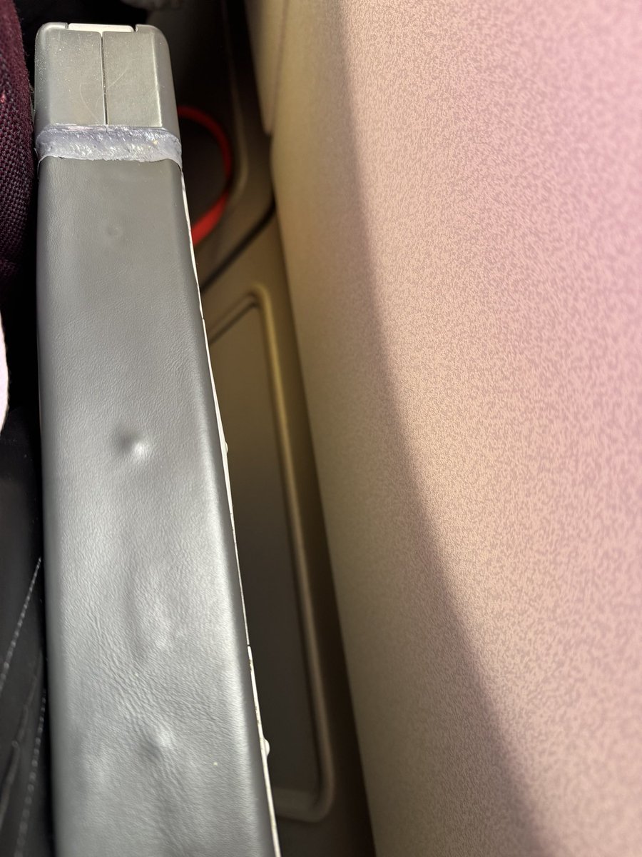 decthepro2's tweet photo. Nothing like using silicone to keep the arm rest on my seat back to Bangalore from Sydney #qantas flight QF 67. Horrible feeling knowing Qantas thinks this is ok!!! https://t.co/vSXnCy4eTH