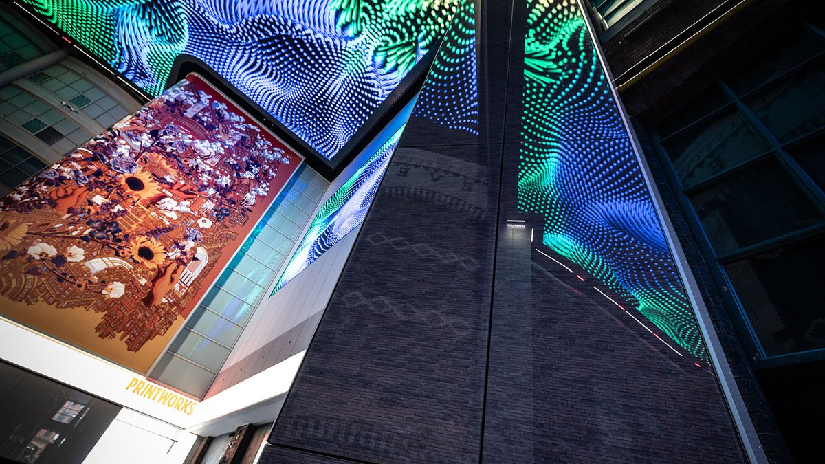 StoLtd's tweet photo. #StoVentec Glass cladding reflects the digital screens installed in the @MCRPrintworks, part of the recent renovations.  The #StoVentec glass panels were digitally printed to meet the design brief of CDA architects. https://t.co/oAFBbjyryS