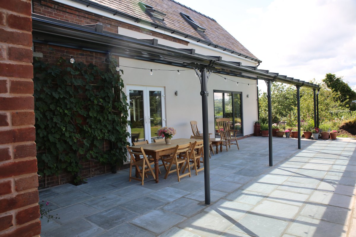 prefixsystems's tweet photo. WOW, what a stunning installation of our Classic Verandah installed by @ArtisanWindows in Denbighshire 👏 

At an impressive 12.4m wide, this Anthracite Grey Verandah complete with S2 roof & self cleaning glass has given the homeowners a sheltered space so they can enjoy their garden all year round.

Get in touch for more info or a quote: enquiries@prefixsystems.co.uk 

#verandah #veranda #pergola #patiodesign