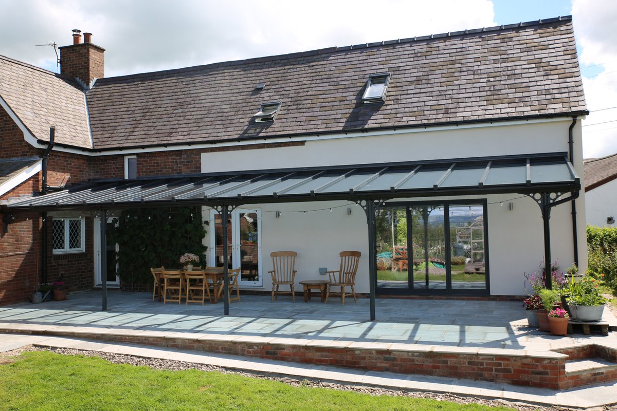 prefixsystems's tweet photo. WOW, what a stunning installation of our Classic Verandah installed by @ArtisanWindows in Denbighshire 👏 

At an impressive 12.4m wide, this Anthracite Grey Verandah complete with S2 roof & self cleaning glass has given the homeowners a sheltered space so they can enjoy their garden all year round.

Get in touch for more info or a quote: enquiries@prefixsystems.co.uk 

#verandah #veranda #pergola #patiodesign