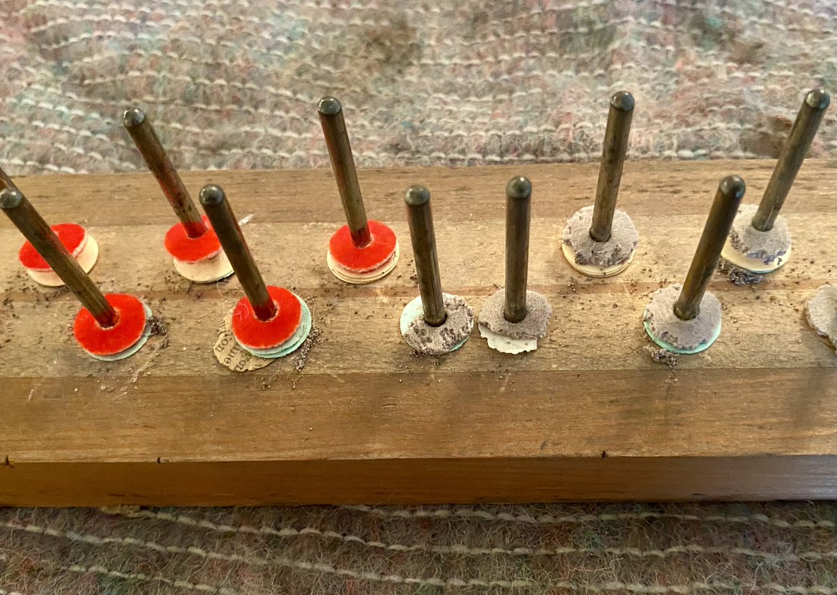 Replacing a moth eaten  set of washers for a smart new set. The piano keys are located on these pins.