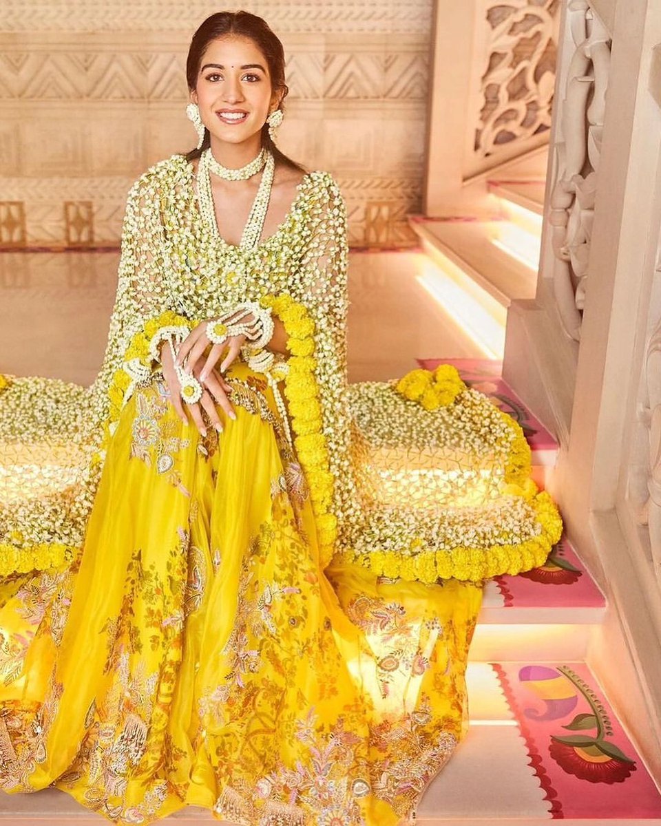 shaadi_fever's tweet photo. Radhika Merchant shines in a yellow Anamika Khanna outfit with real flower odhni, for her haldi ceremony. 
Read more- https://t.co/DEQuoVtg9W 
#RadhikaMerchant #AnantAmbani https://t.co/5XwMrRWe4n