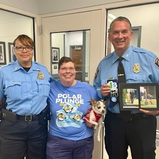 PWCPolice's tweet image. Shout out to @SpecialOlympics Global Messenger Rose Reeder &amp;amp; her dog, Mr Wiggles. Rose gifted @ChiefNewsham a photo of them lighting the Torch together at the #SummerGames &amp;amp; Torch Run socks to match hers that he had complimented her on during the games. What a heart! Thanks Rose.