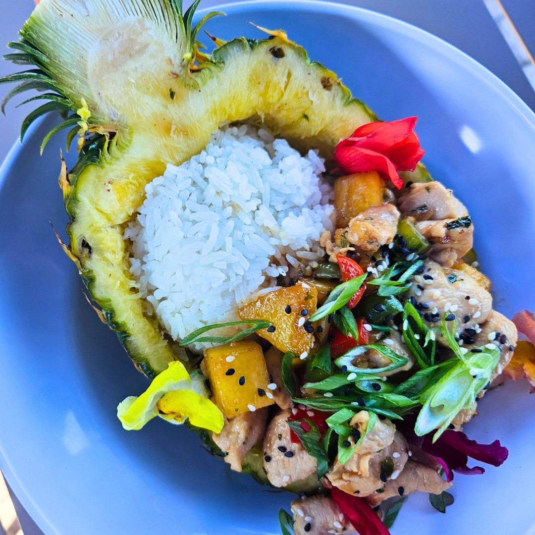 Get transported to paradise when you order our FAMOUS Pineapple Chicken! 🍍tangy chicken, sesame, coconut rice, served in a REAL pineapple boat! #blockisland #rhodeisland #ballardsbeach