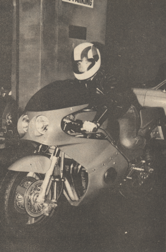 Imagine Software co-founder Mark Butler arrives at his offices astride a custom-made motorbike circa 1983.