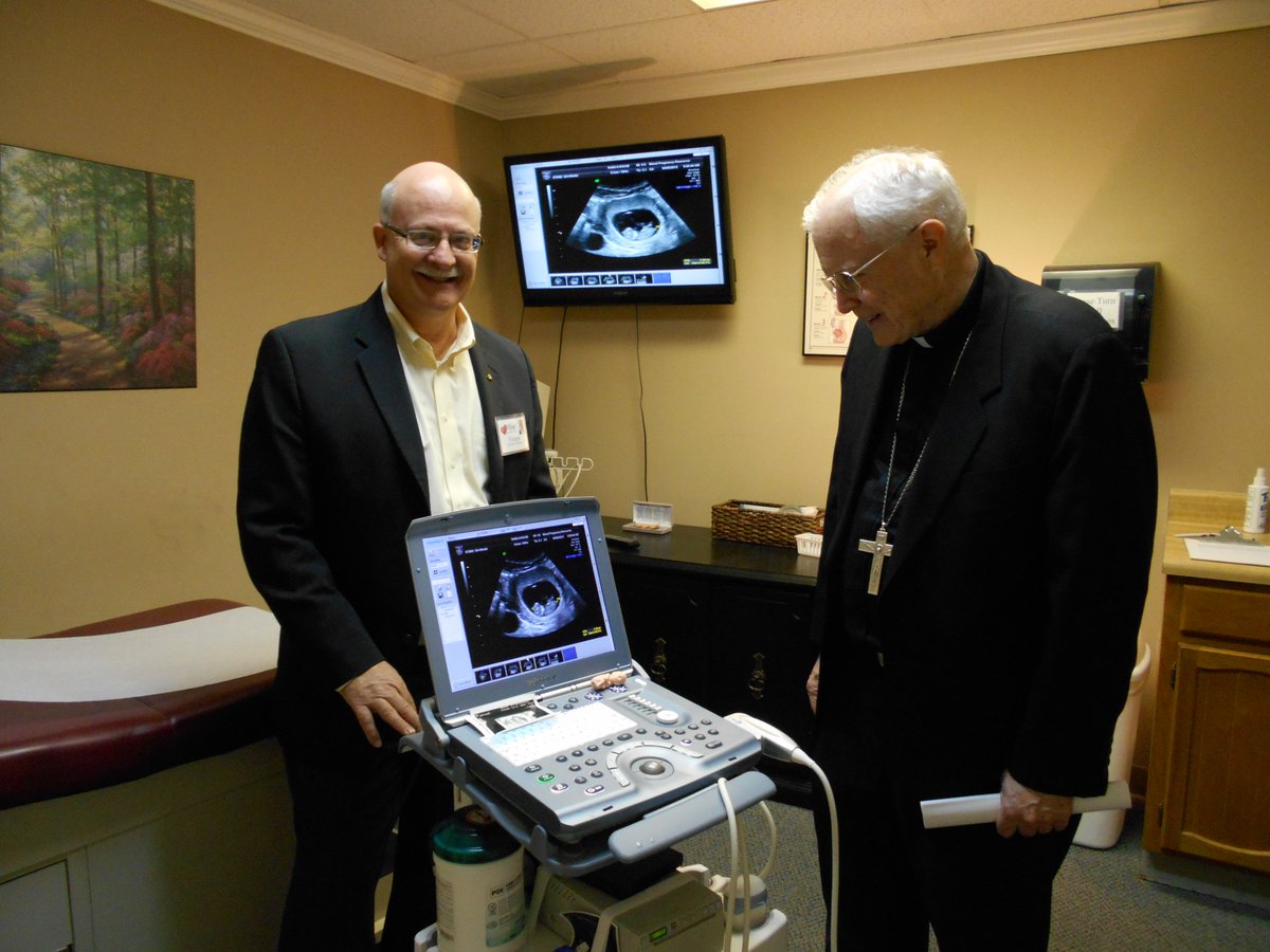 MendMedical_Ok's tweet photo. Today, we are going back 11 years to show you this picture of our previous director, Forrest Cowan, and a priest with our ultrasound machine. A lot has changed since this photo. Our ultrasounds are done in a completely different room now with a machine that does 3D ultrasounds. https://t.co/Fe9cM6IbQM
