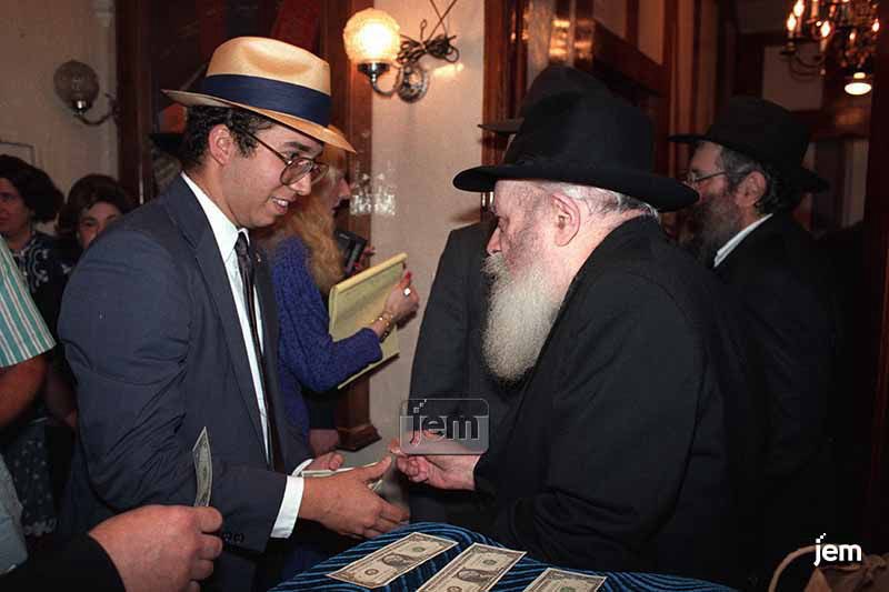 herblock's tweet image. To remember the Lubavitcher Rebbe on his 30th yahrzeit today (3 Tammuz) I share some photos from 35 years ago of a few of the times I was privileged to meet Rabbi Menachem Mendel Schneerson OBM. I still have the dollar in my wallet! Plus a letter the Rebbe sent when I was born!