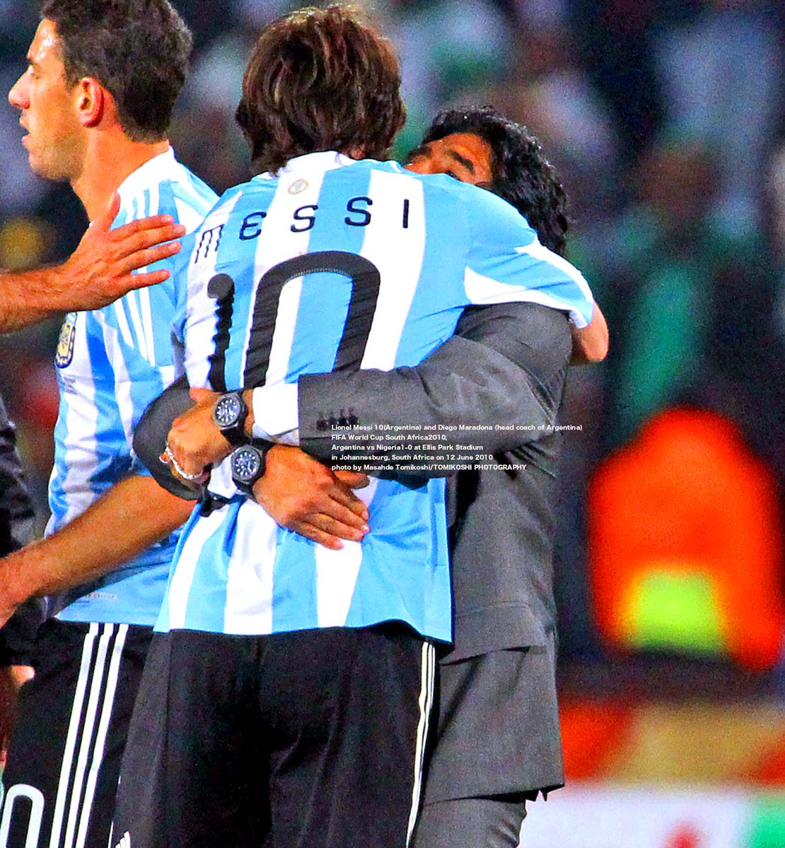Argentina's Lionel Messi, left, is tackled by Nigeria's Sani Kaita, right,  during the World Cup group B soccer match between Argentina and Nigeria at  Ellis Park Stadium in Johannesburg, South Africa, Saturday,, image size:1110x1200
