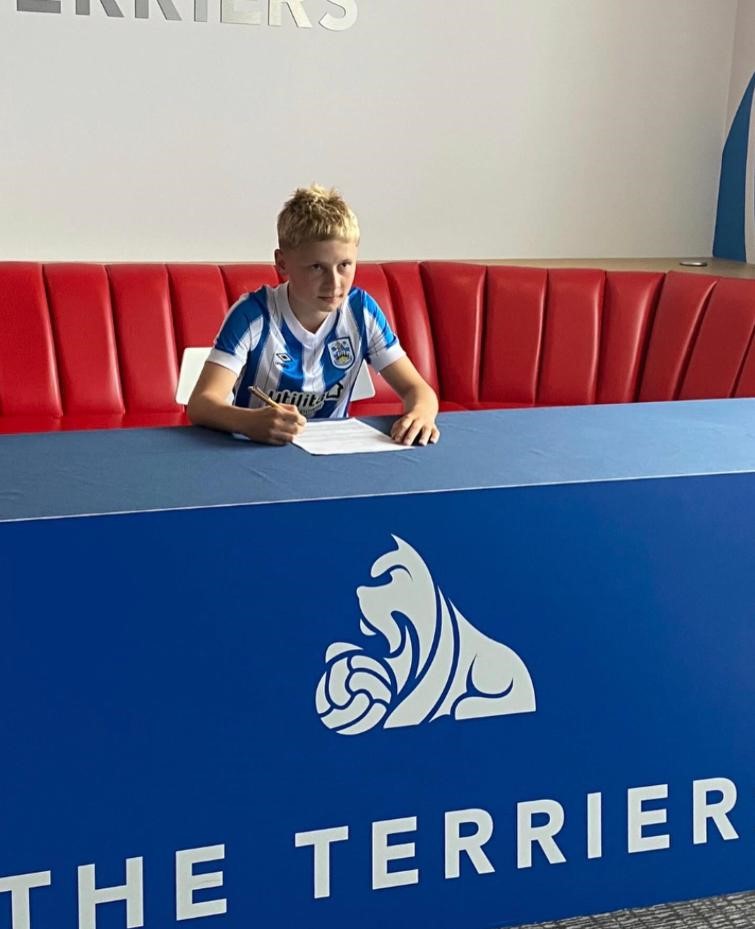 HarrogateGS's tweet photo. Well done to Year 7 student Caleb who has signed for Huddersfield Town Academy. Huge congratulations to him on such a fantastic achievement #Huddersfieldtown #YoungTalent #SportsAchievement #HGSSport https://t.co/GN2RFnVxJ3
