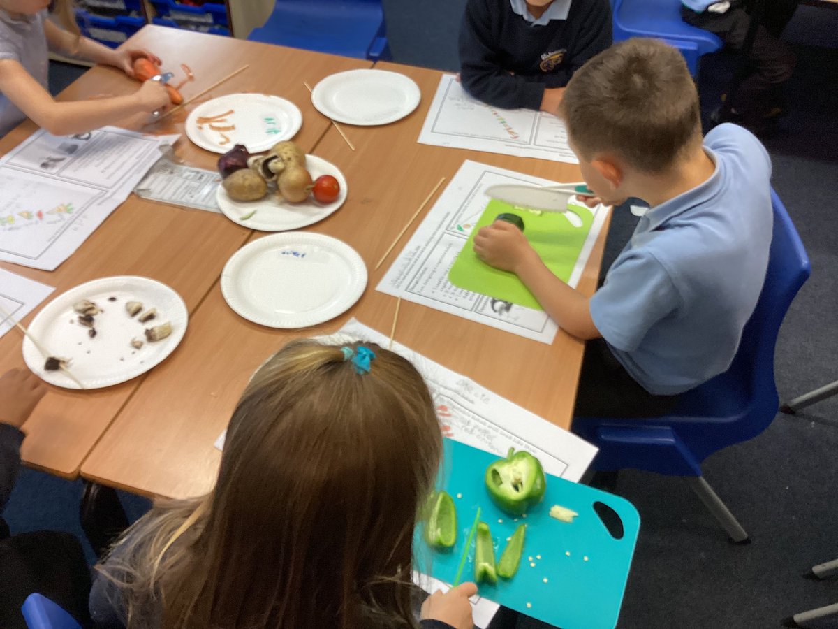 StJosephU's tweet photo. 1KW have been busy peeling and chopping veg for their vegetable kebabs. We can’t wait to try them. #SJUDT https://t.co/mMXcvluvG4
